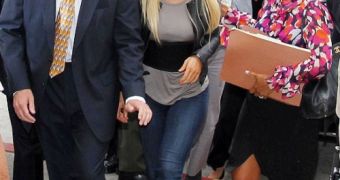 Lindsay Lohan arrives to court to turn herself in and begin a 90-day sentence of which she’ll only serve 14