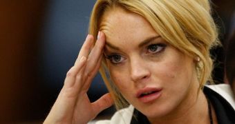 Lindsay Lohan is sticking with her miscarriage story in court so she can win the trial