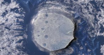 This view of an inverted crater in the Arabia Terra region of Mars is among the images taken by MRO in early 2010 as the spacecraft approached the 100-terabit milestone in total data returned