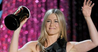 Jennifer Aniston is all smiles as she wins Best Dirtbag at the MTV Movie Awards 2012