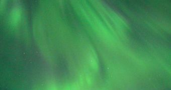 Auroras form when particles from solar flares slam into the Earth's magnetosphere