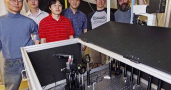 Research team members stand with equipment used for gyromagnetic imaging of gold nanostars