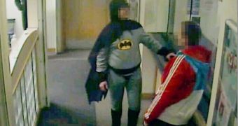 Batman brings in a suspect at a police station in West Yorkshire, UK