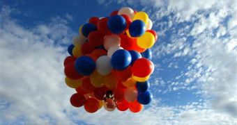 Image of Couch lifting off into the sky with the help of only 150 balloons and a lawn chair