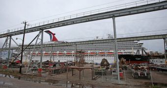 a man is thrown overboard as the Carnival Triumph ship breaks free in the Mobile port