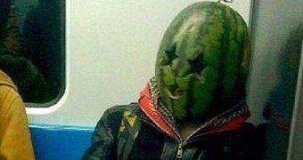 Man in China likes to wear a watermelon on his head when riding the subway