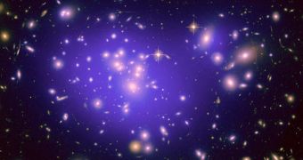 This image shows the galaxy cluster Abell 1689, with the mass distribution of the dark matter in the gravitational lens overlaid (purple)