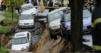 Giant crater sucks in several parked cars in north-east Baltimore
