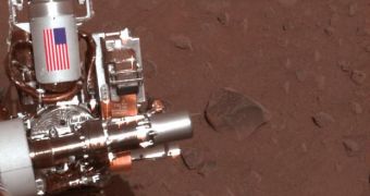 The piece of metal with the American flag on it in this image of a NASA rover on Mars is made of aluminum recovered from the site of the World Trade Center towers in the weeks after their destruction