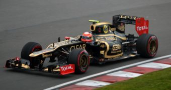 The Microsoft Dynamics branding is showcased on the Lotus F1 car