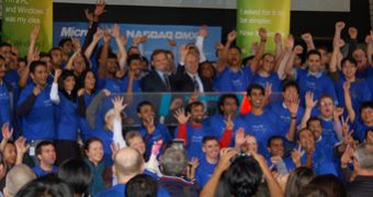 Windows 7 engineers and Microsoft Chief Financial Officer Chris Liddell open the NASDA