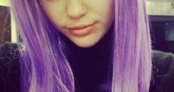 Miley Cyrus tries out a wig before getting into her Lil Kim Halloween costume