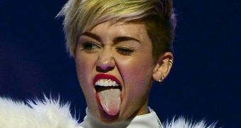 Miley Cyrus gets upset when a woman asks her to put her tongue back into her mouth for a fan photo