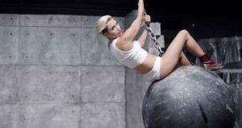A heartbroken Miley Cyrus shows her pain by riding a wrecking ball in new video
