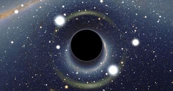 This image shows a black hole. The object itself is not visible, since it traps all radiation aimed at it, including light