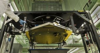 The JWST mirror segment is seen here while being loaded into the CMM