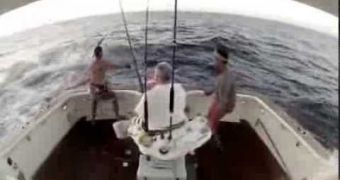 Angler gets startled when marlin jumps on boat