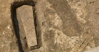 Archaeologists dig out 600-year-old coffin hidden inside stone tomb