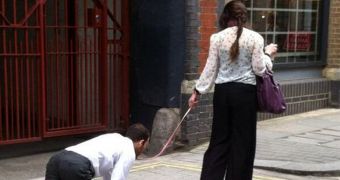 Pictures of a woman walking a man like a dog through central London went viral last week