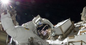 Sunita Williams waves at the camera during an Expedition 32 spacewalk, on September 5, 2012