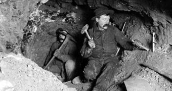 Miners working to take out ore in a gold mine in Eagle River Canyon, Colorado.