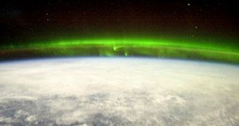 This image shows northern lights (auroras) as seen from the upper ionosphere
