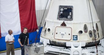 SpaceX CEO Elon Musck (speaking) and NASA Administrator Charles Bolden inspect the first Dragon to reach the ISS