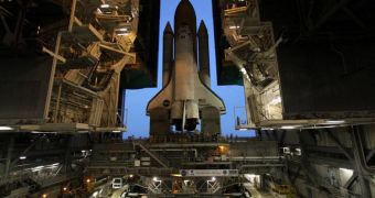 Shuttle Discovery is seen here rolling out of the VAB at the Kennedy Space Center, before its last mission ever