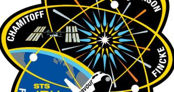 The design of the STS-134 crew patch highlights research on the International Space Station (ISS) focusing on the fundamental physics of the Universe