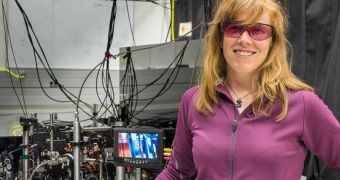 NIST physicist Elizabeth Donley with a compact atomic clock design that could help improve precision in ultraportable clocks