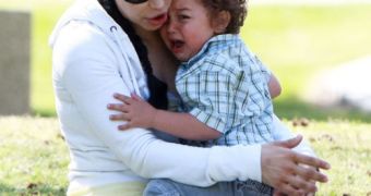 Nadya Suleman enjoying a day at the park – seen here with one of her 14 children