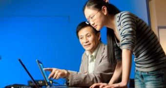 NJIT Professor of Electrical and Computer Engineering Yun-Qing Shi (left) discusses a techical problem with his graduate student