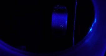 This is a suspension of nanoparticles in a quarz-glass cell exposed to ultraviolet light. The nanoparticles emit deep-blue fluorescence