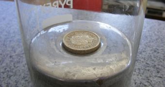 A pound coin (density ~7.6 g/cm3) floating in mercury