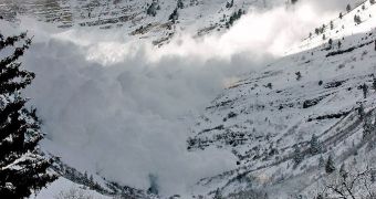 An avalanche sweeping a mountainside, in Utah