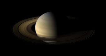 From 20 degrees above the ring plane, Cassini's wide angle camera shot 75 exposures in succession for this mosaic showing Saturn, its rings, and a few of its moons a day and a half exactly after the Saturn equinox