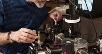 In his Johns Hopkins materials science lab, Professor Howard E. Katz adjusts probes used for testing electronic devices