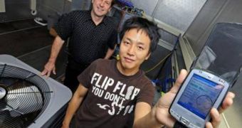 Purdue mechanical engineering graduate student Woohyun Kim, at right, and James Braun, a professor of mechanical engineering, use a new technique designed to save energy and servicing costs by indicating when air conditioners are low on refrigerant