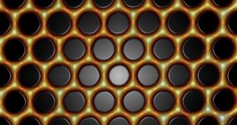 Precisely positioned carbon monoxide molecules (black) guide electrons (yellow-orange) into a nearly perfect honeycomb pattern called molecular graphene