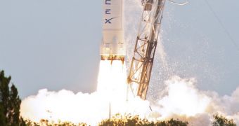 Image of a Falcon 9 rocket launching into space with an unmanned Dragon space capsule