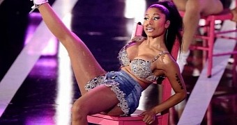Yes, that is Nicki Minaj sitting down, and she claims she's all natural down there