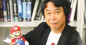 Shigeru Miyamoto cradling his baby