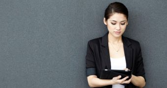 Asian business woman using iPad