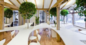 Office building uses trees and potted plants to keep the people working in it happy and calm