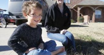 Ashley Warden sits with son Dillan, the public offender