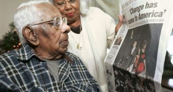 George Francis, who voted for Barack Obama, and Daughter Lelia LaRue look at news of his victory