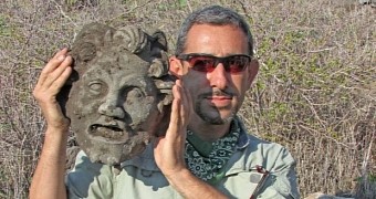 Researcher Michael Eisenberg pictured holding the mask