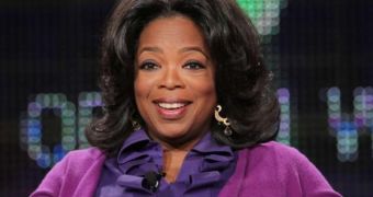 Oprah strained her back on her birthday, trying to pick up a flower arrangement from Tyler Perry