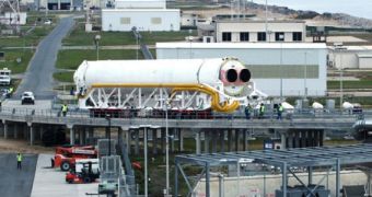 The first stage of the OSC Antares rocket is seen here during rollout to its launch pad, at NASA Wallops