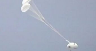 This image shows the Orion MPCV model in flight, during its third parachute test